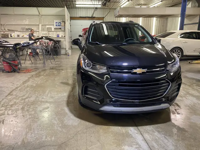 The repaired Chevrolet Trax seen from the side